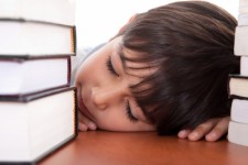 Picture of sleeping boy with books