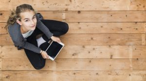 girl holding digital tablet