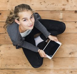 girl holding digital tablet