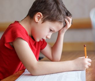 child strugging with homework