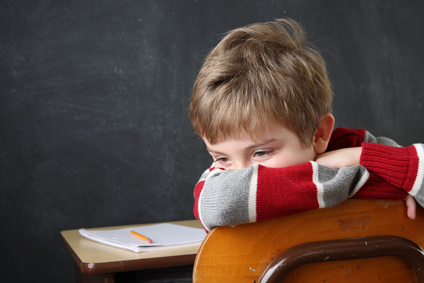 Frustrated child at school desk