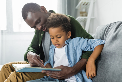 fatehr reading to son