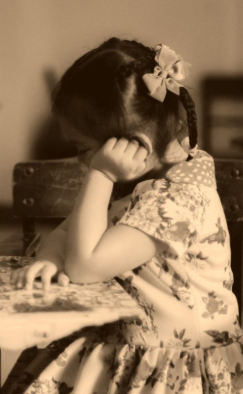 girl seated at desk