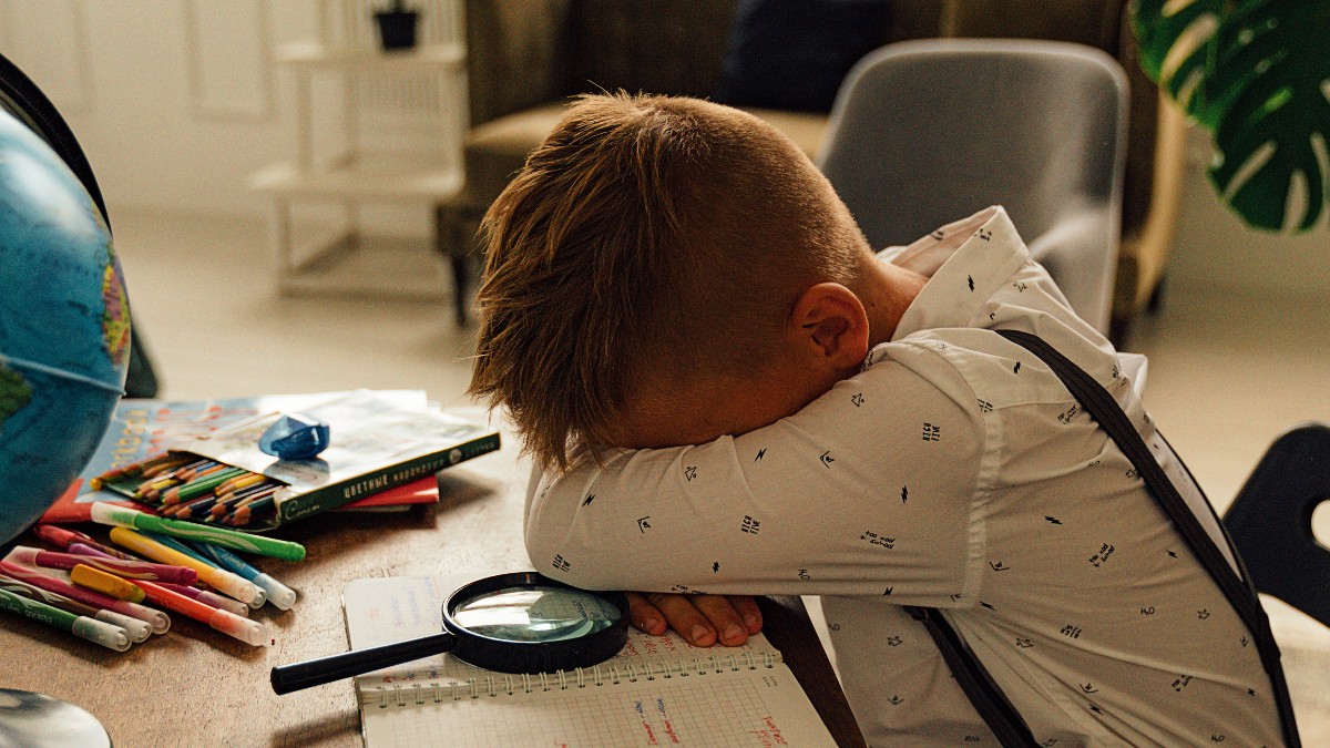 Child with head on desk