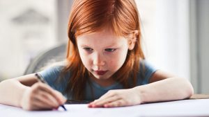 Young girl writing