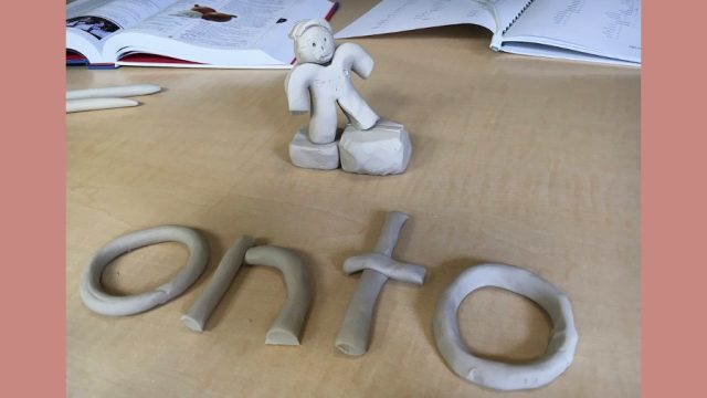 clay model of the word onto