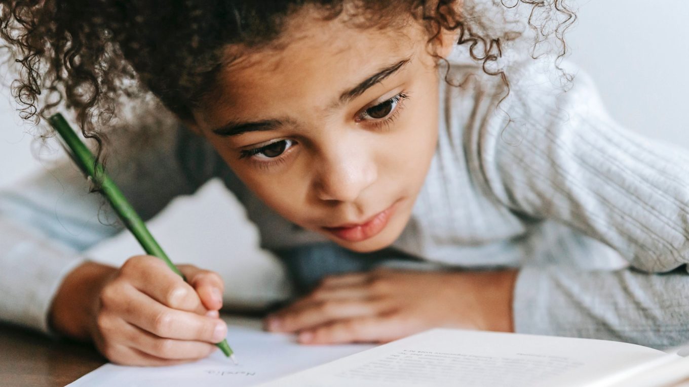 girl with pencil and notebook