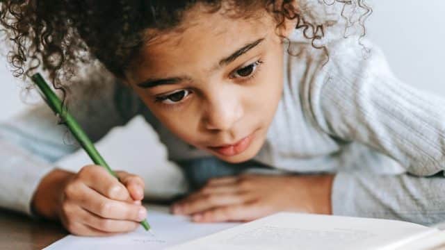 girl with pencil and notebook